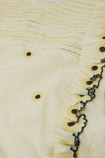 beige blouse with cotton embroidery detail