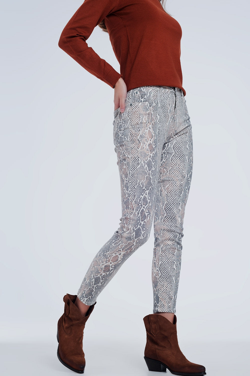 beige coloured pants with snake print