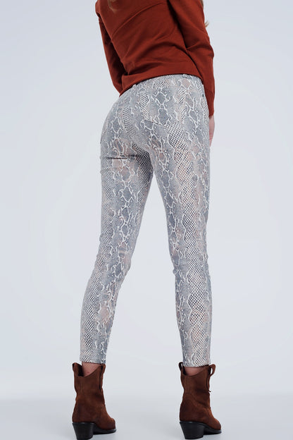 beige coloured pants with snake print