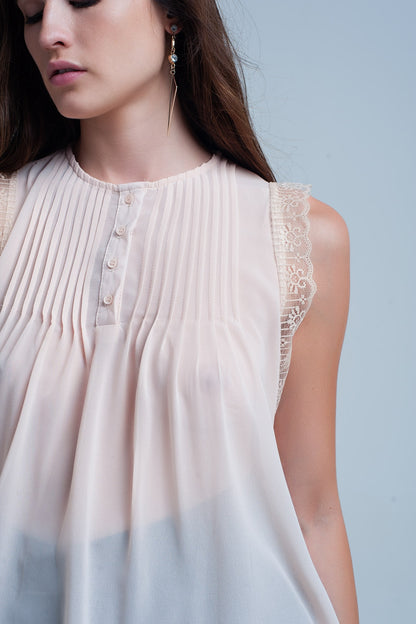 Beige sleeveless top with lace details