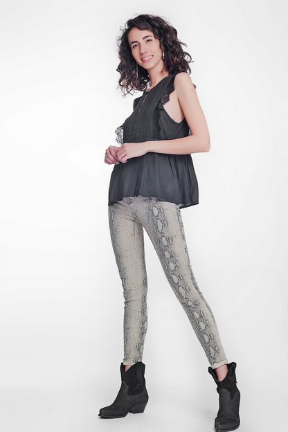 beige super skinny reversible pants with snake print