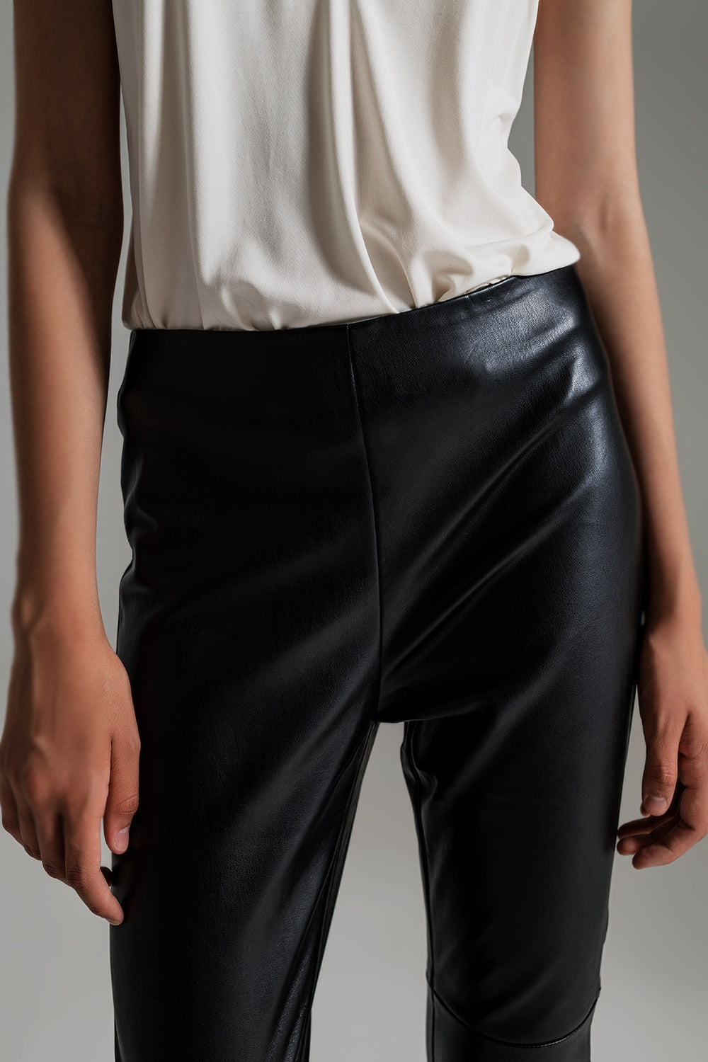 black faux leather effect skinny pants