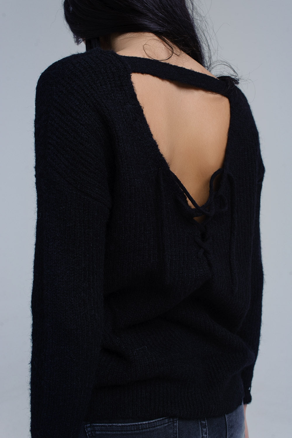 Black knitted sweater with tie-back closure