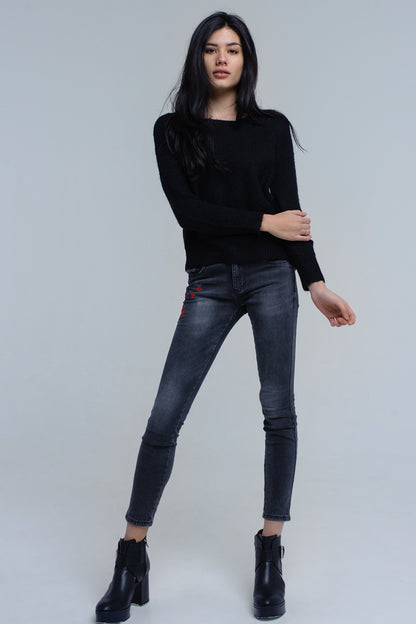 Black knitted sweater with tie-back closure