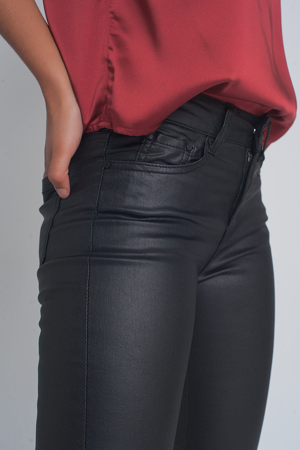 Black leather effect trousers with hem lace-up