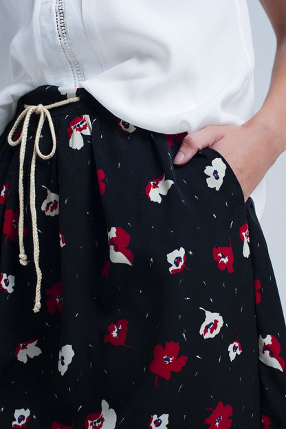 Black mini skirt with floral pattern