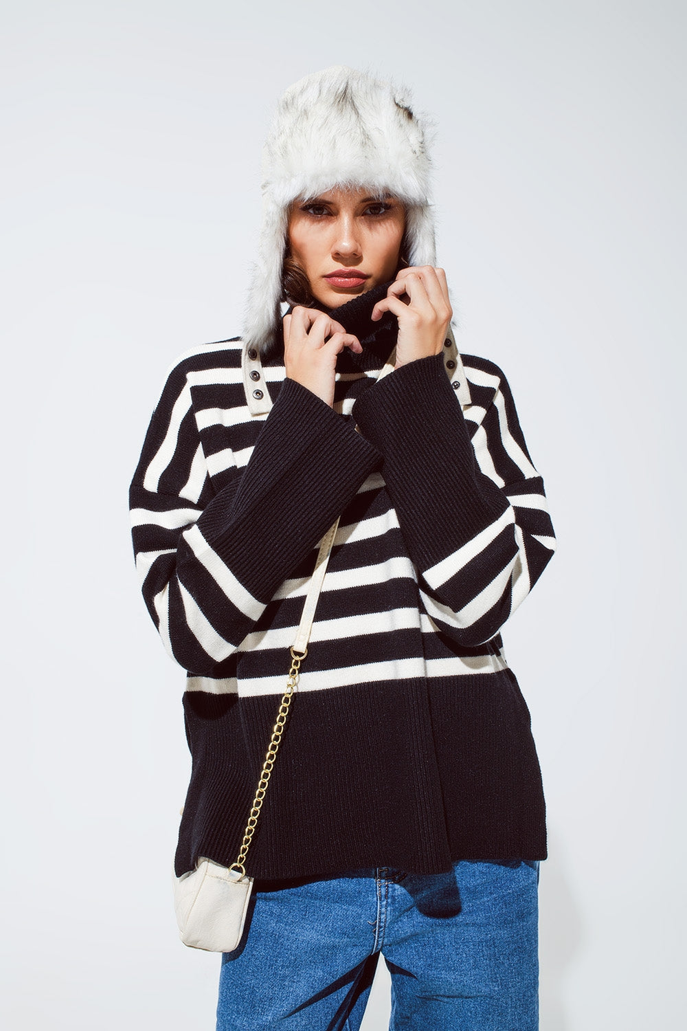 Black oversized trutleneck sweater with white stripes and splits on the side