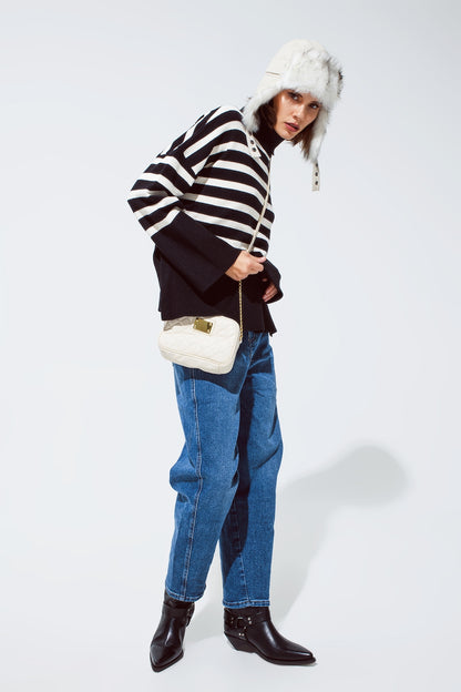 Black oversized trutleneck sweater with white stripes and splits on the side