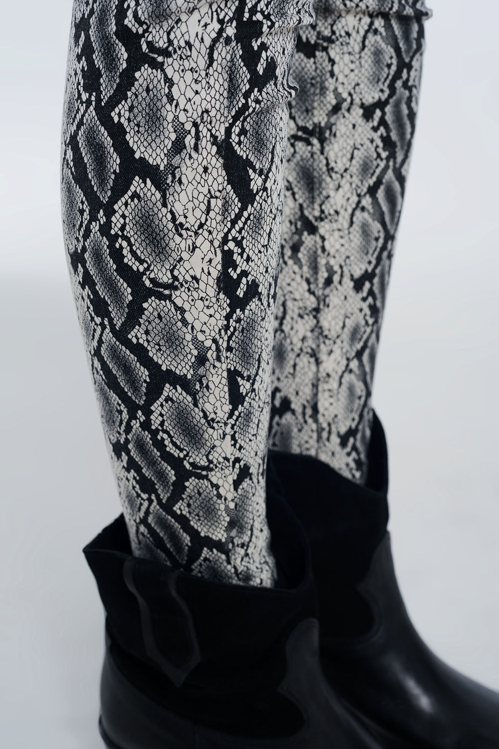 Black pants with snake print