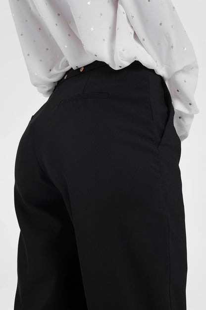 Black pants with wide legs and low hem