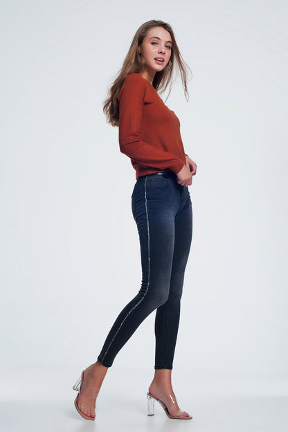 Black skinny jeans with shiny stones detail on the side