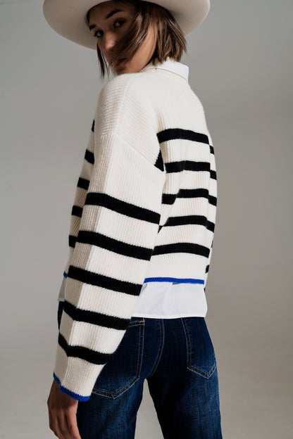 black striped jumper with blue stripe detail on the bottom