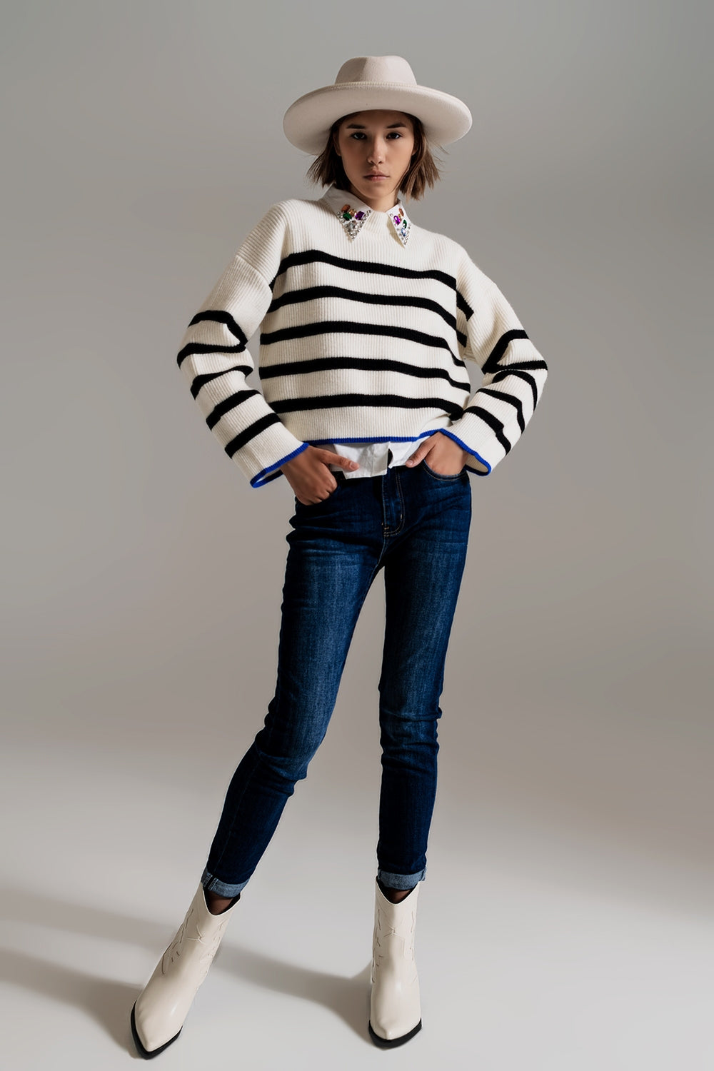 black striped jumper with blue stripe detail on the bottom