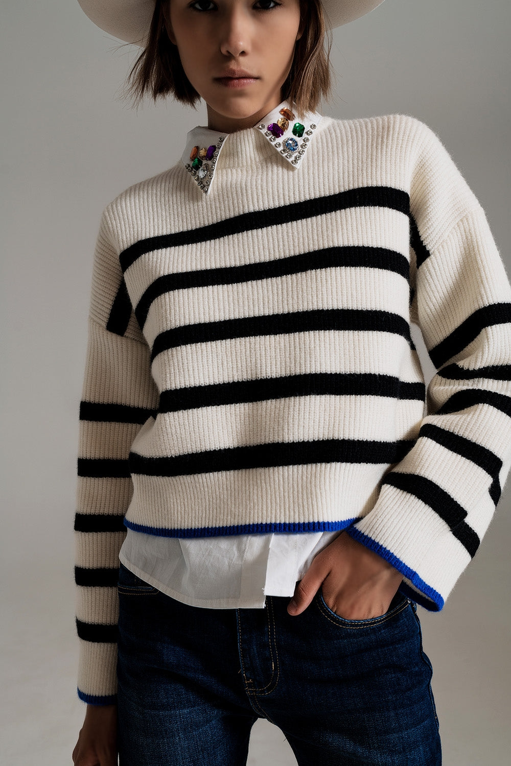 black striped jumper with blue stripe detail on the bottom