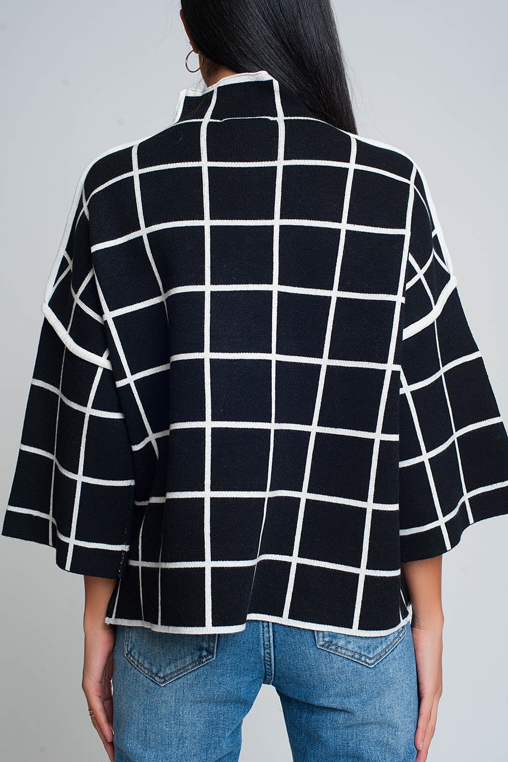 Black sweater with chequered print in 3/4 sleeve and high neck