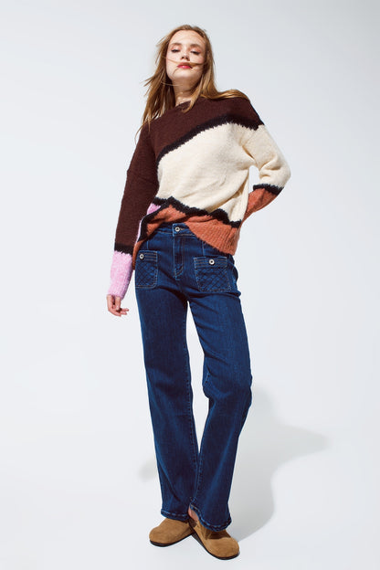 Blue jeans with buttoned pocket details in dark wash