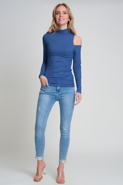 Blue sweater with one open shoulder and high neck