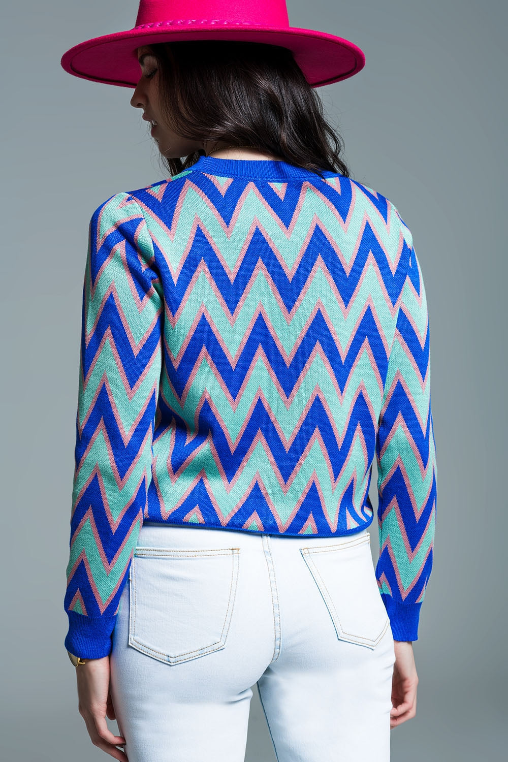 Blue sweater with  zig zag print in blue with pink details