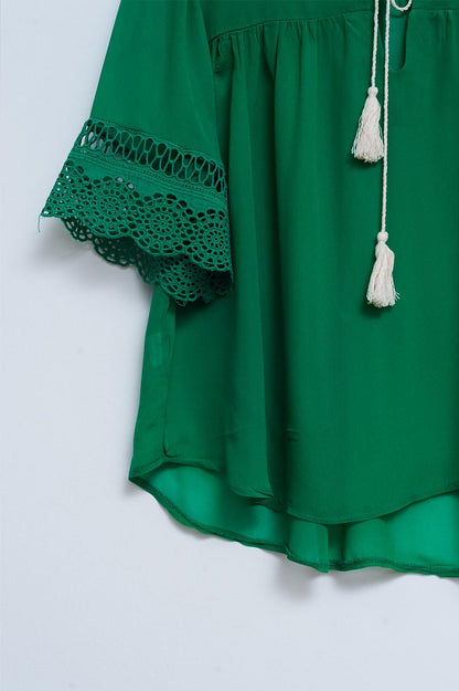 Broderie tie front blouse in green