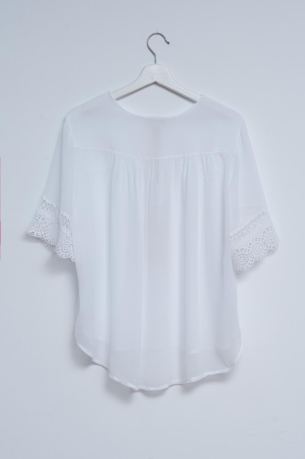 Broderie tie front blouse in white