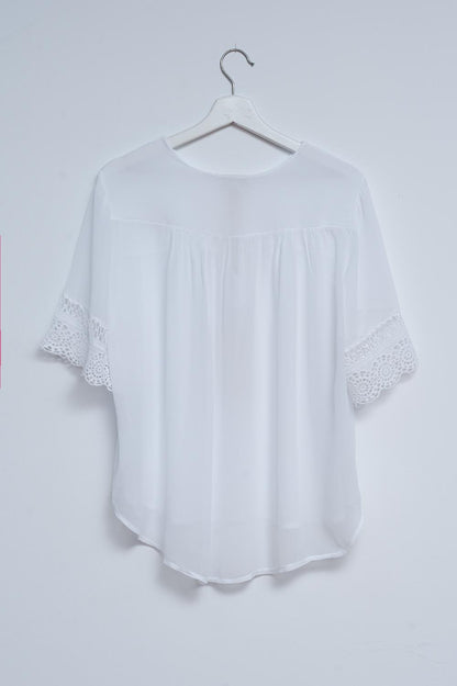 Broderie tie front blouse in white