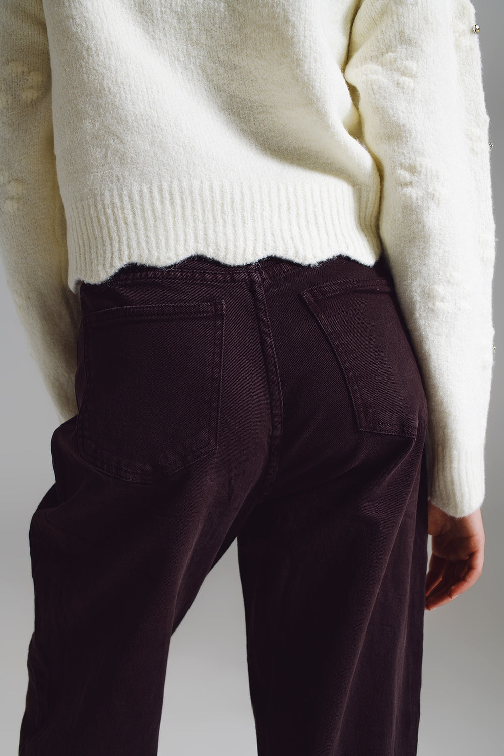 Brown relaxed pants with pocket detail at the waist