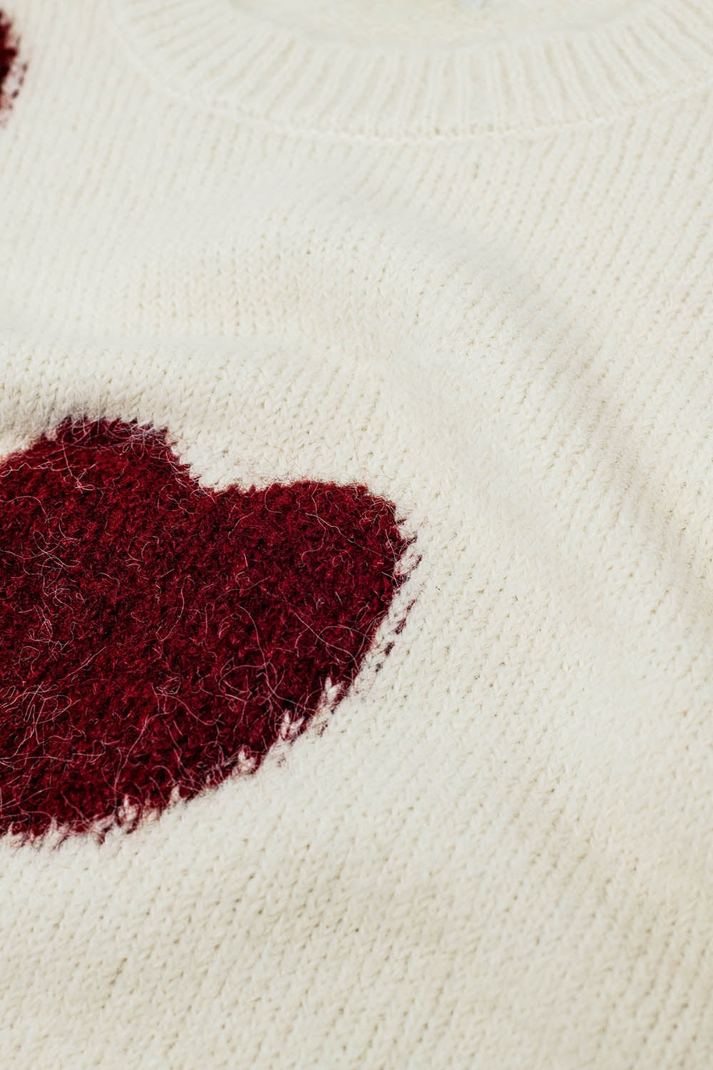 cozy white sweater with red hearts