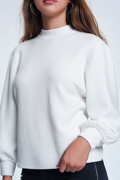 Cream colored sweatshirt with long sleeves