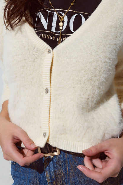 cream fluffy cardigan with silver buttons