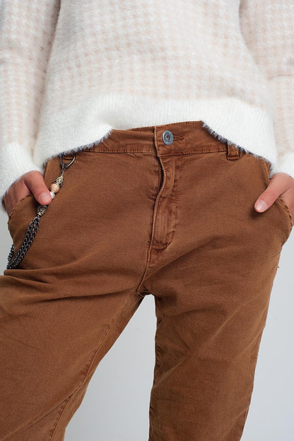 Cuffed utility pants with chain in brown