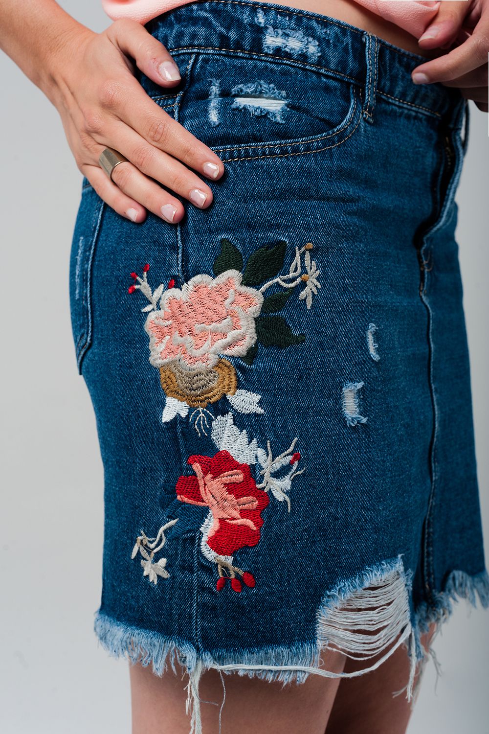 Denim mini skirt with embroidered flowers