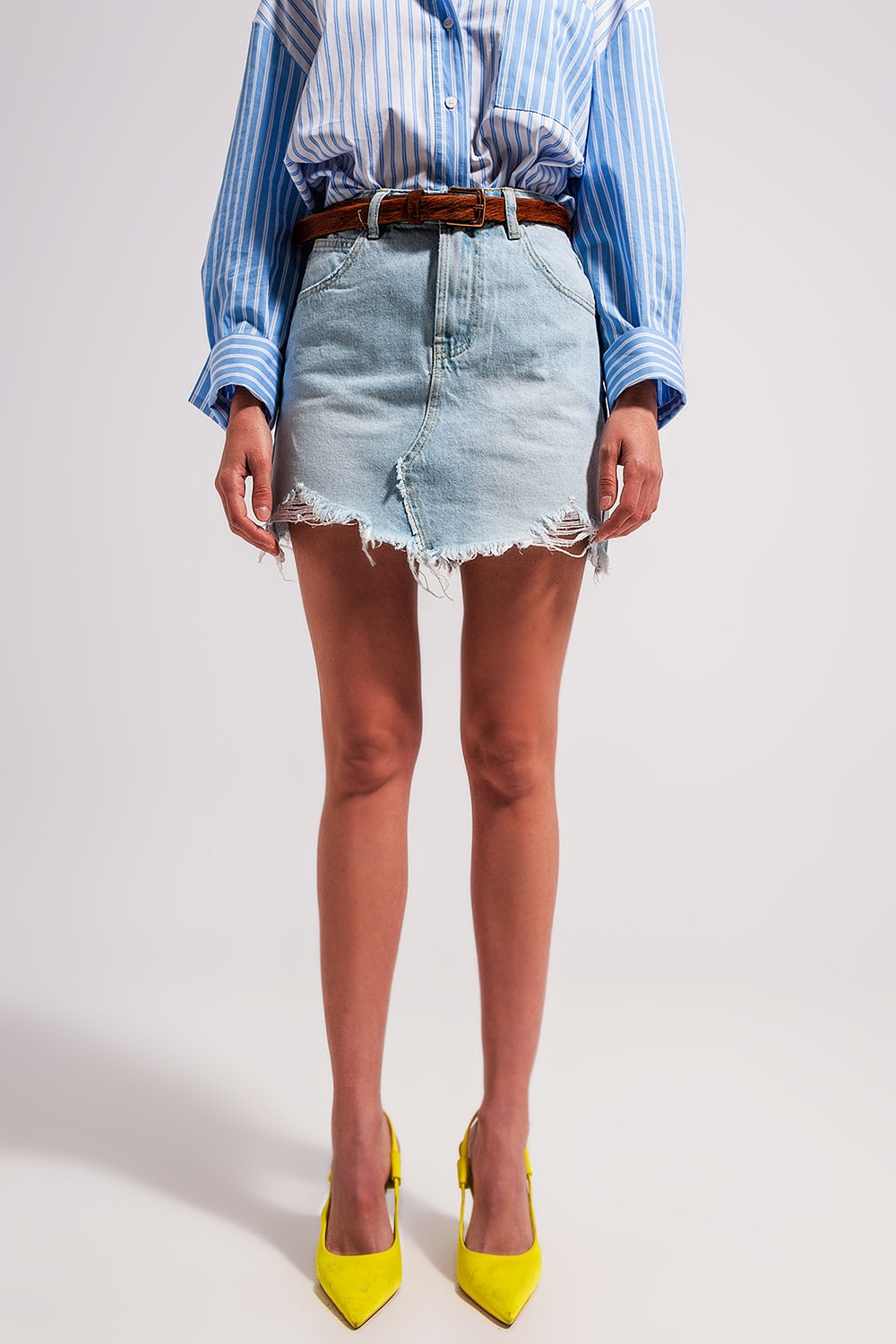 Q2 Denim mini skirt with raw hem in light wash blue