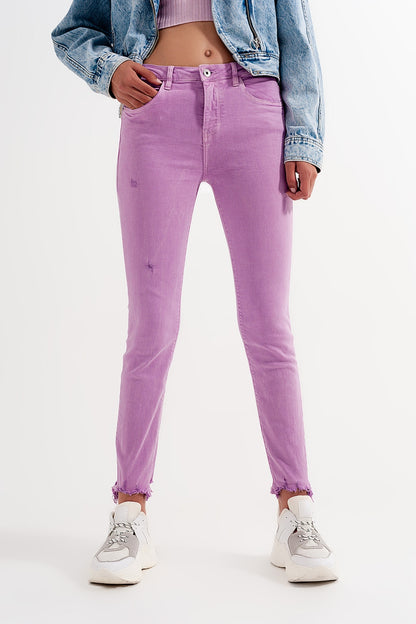 Distressed raw hem skinny jeans in lilac