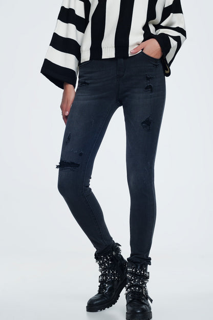 Distressed skinny jeans in black