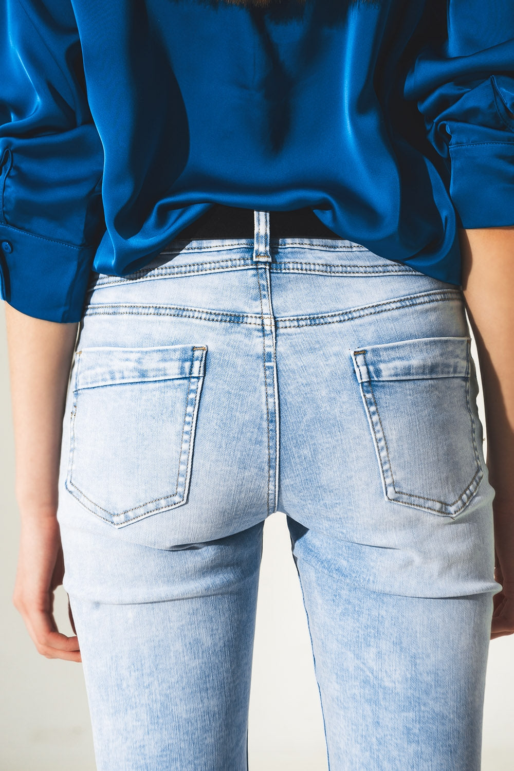 Distressed straight jeans with hem detail in blue