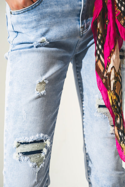 Distressed straight jeans with hem detail in blue