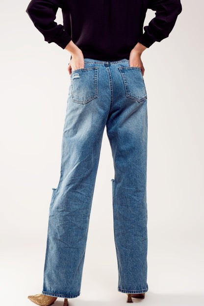 Distressed straight leg jean in medium denim