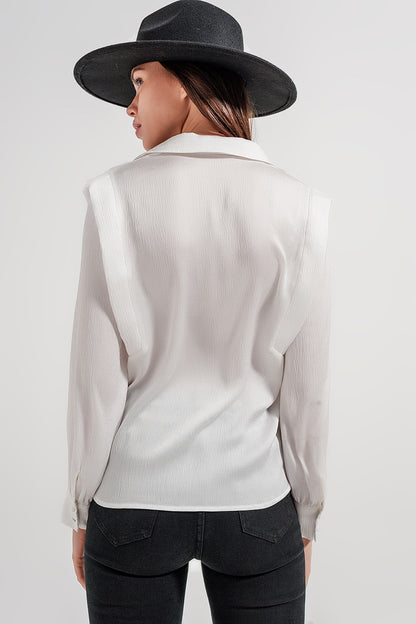 Ecru blouse with ruffle details