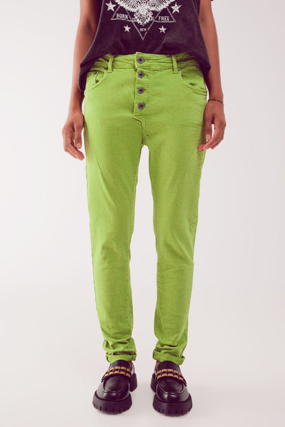 Exposed buttons skinny jeans in green