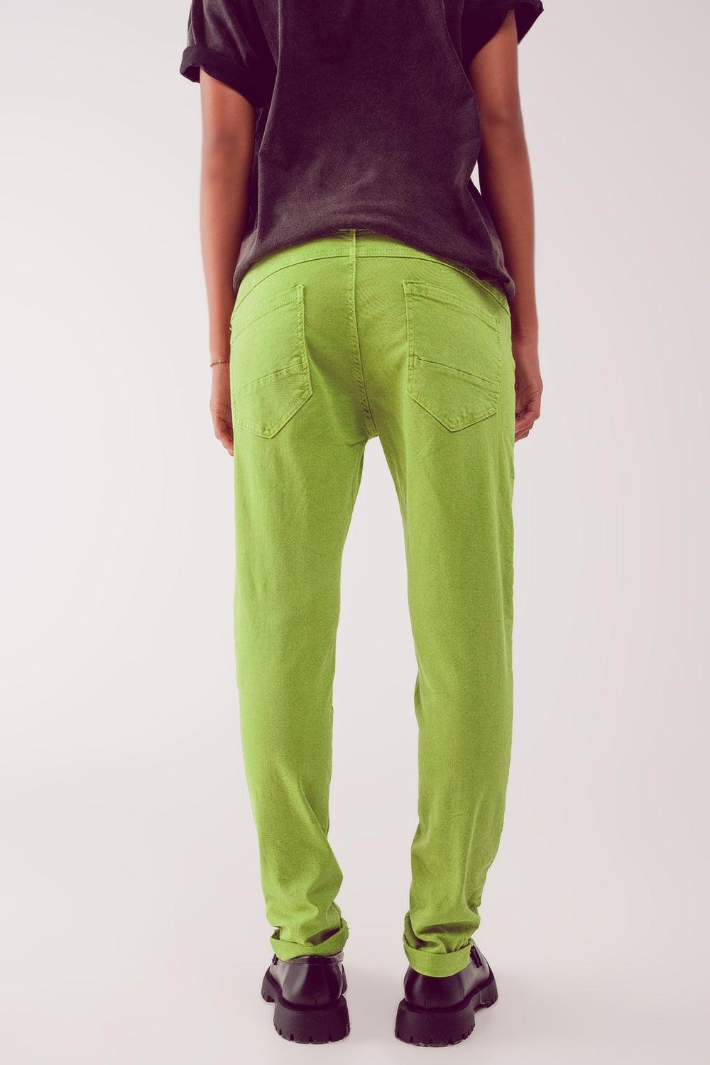 Exposed buttons skinny jeans in green