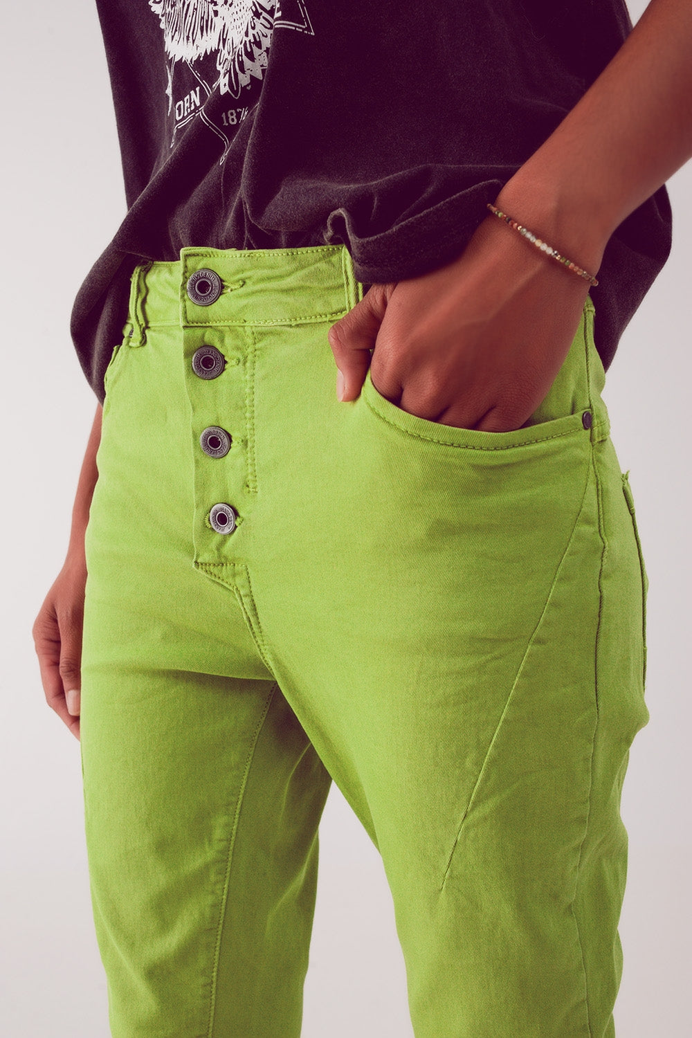 Exposed buttons skinny jeans in green