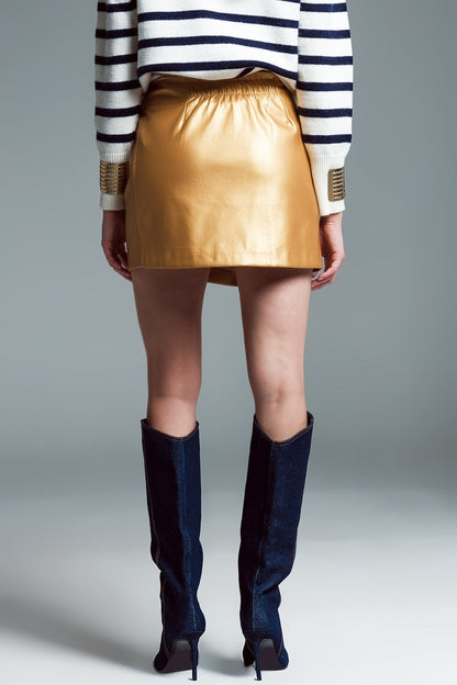 faux leather mini skirt with bow on the side in gold