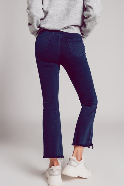 Flare jeans with raw hem edge in blue ink