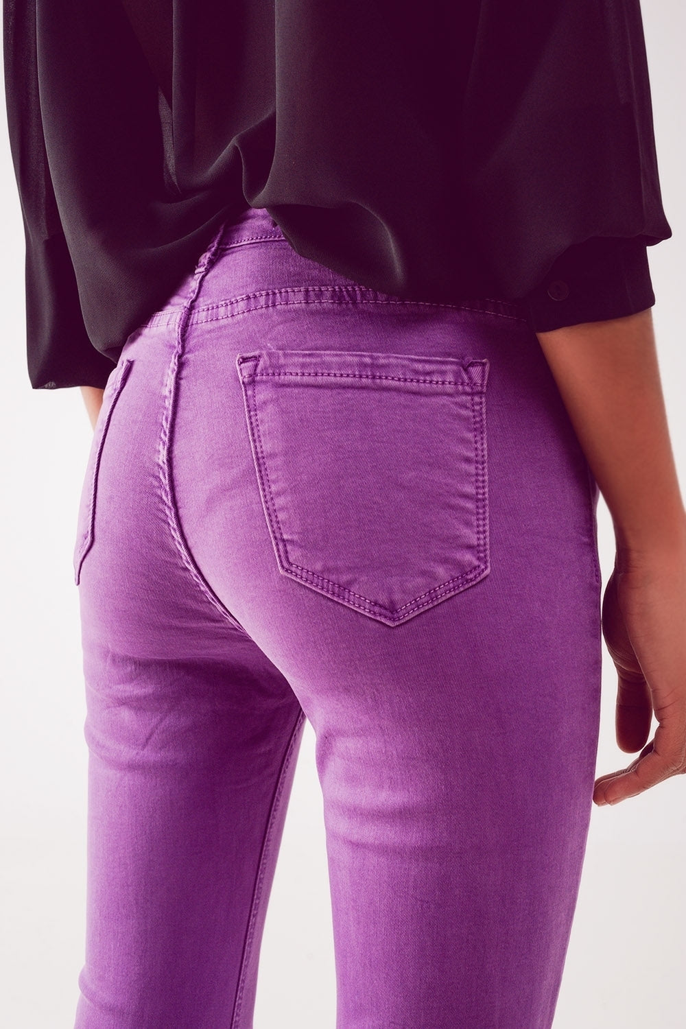 Flare jeans with raw hem edge in purple