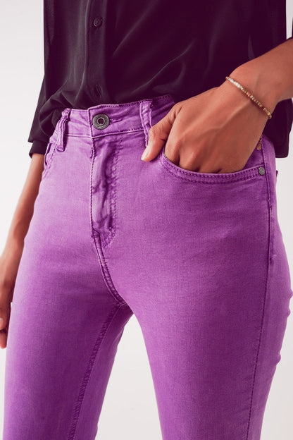 Flare jeans with raw hem edge in purple