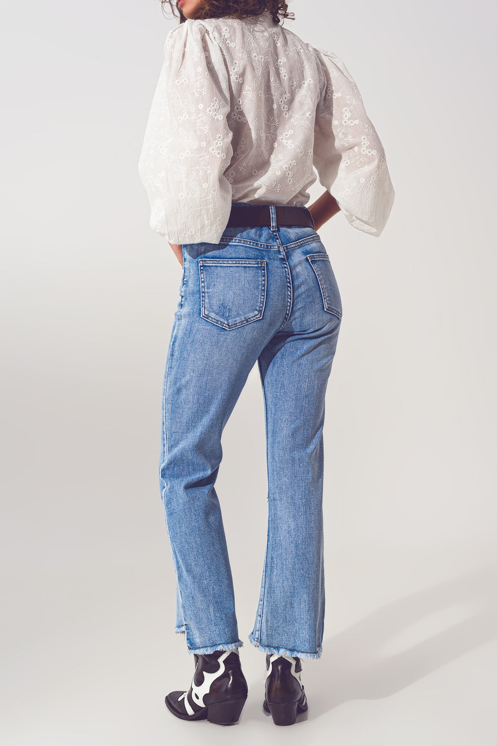 Flared Jeans in Light Blue with Asymmetric Hem