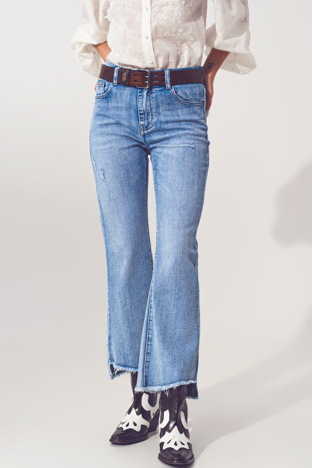 Flared Jeans in Light Blue with Asymmetric Hem