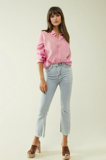 Flared light blue jeans with five pockets and seamless finish