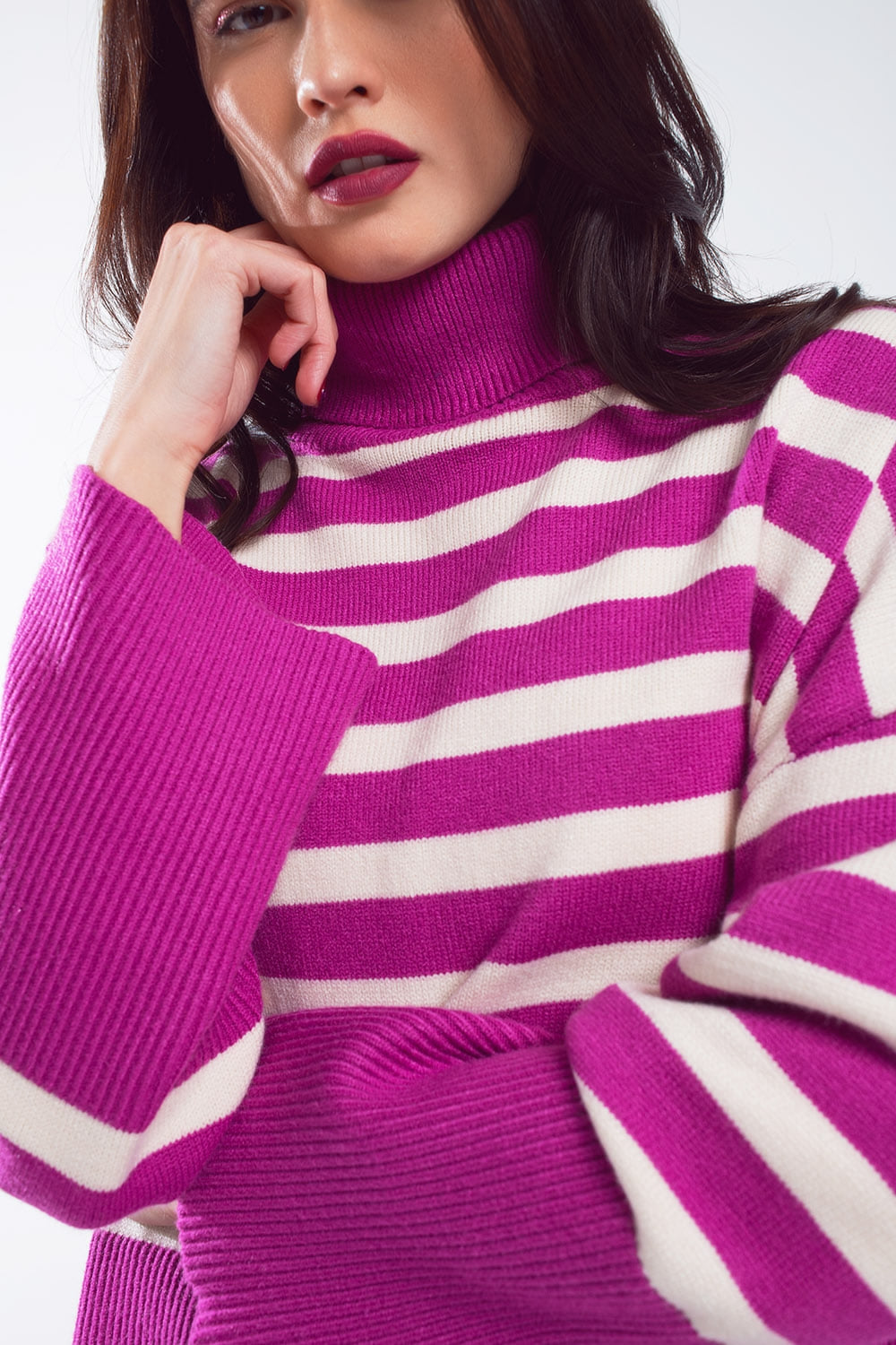 Fuchsia oversized trutleneck sweater with white stripes and splits on the side