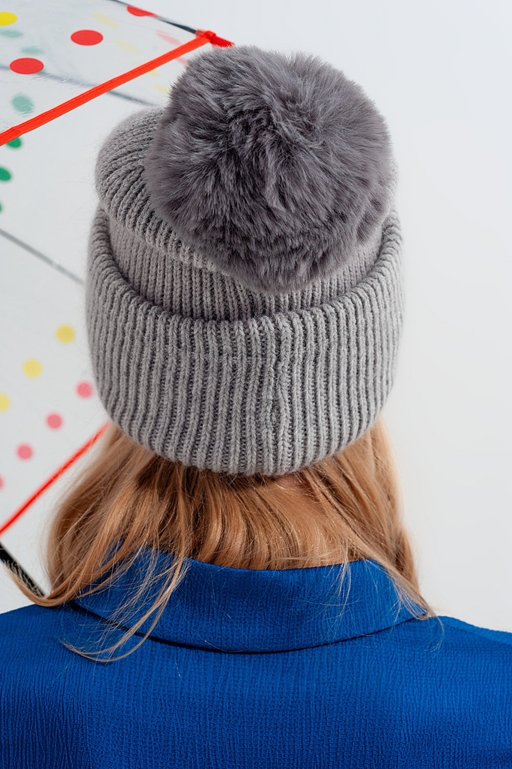 Gray knitted hat with pompom